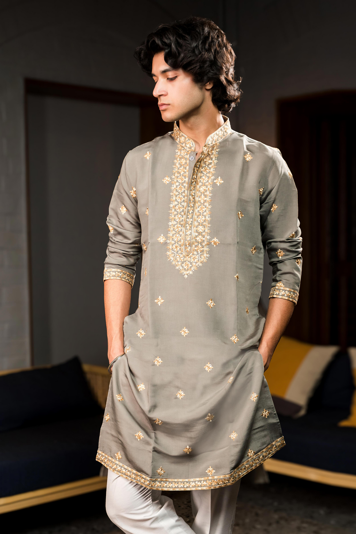 Grey silk kurta with gold embroidery.