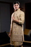 Gold long kurta jacket pant set.