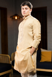 Gold long kurta jacket pant set.